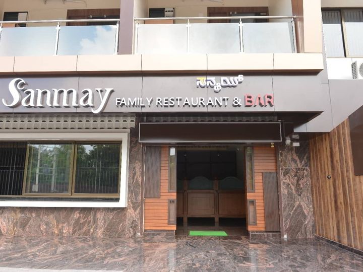 Front of the family restaurant and bar with its signboard above the door